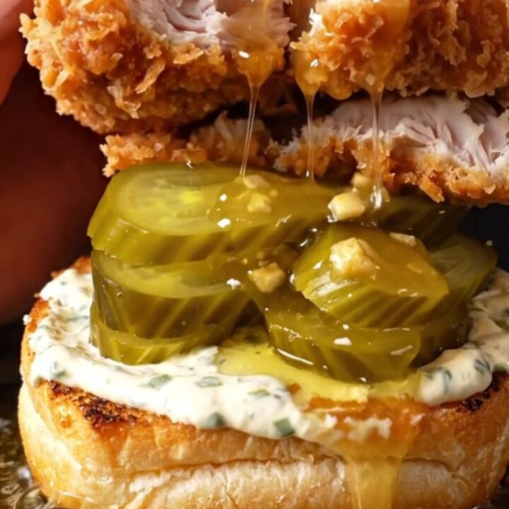 Crispy chicken sandwich with honey chipotle glaze, ranch, and pickles on a brioche bun