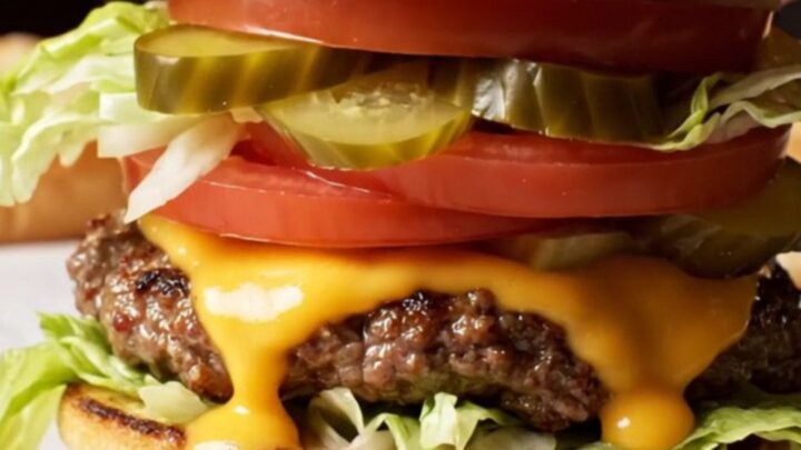 Double-double smash burger with two melted cheese patties, caramelized onions, and spread on a toasted bun