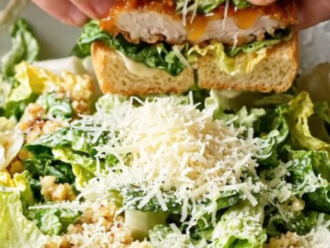 Hot honey glazed chicken Caesar sandwich with crispy chicken, Parmesan, and lettuce on toasted bread