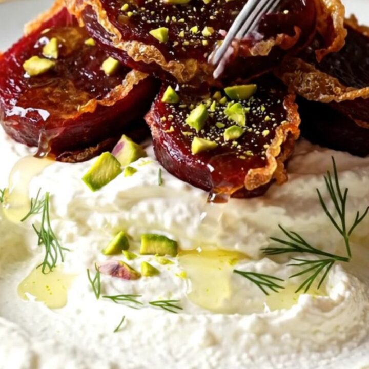 Crispy smashed golden beets over whipped goat cheese with honey and pistachios