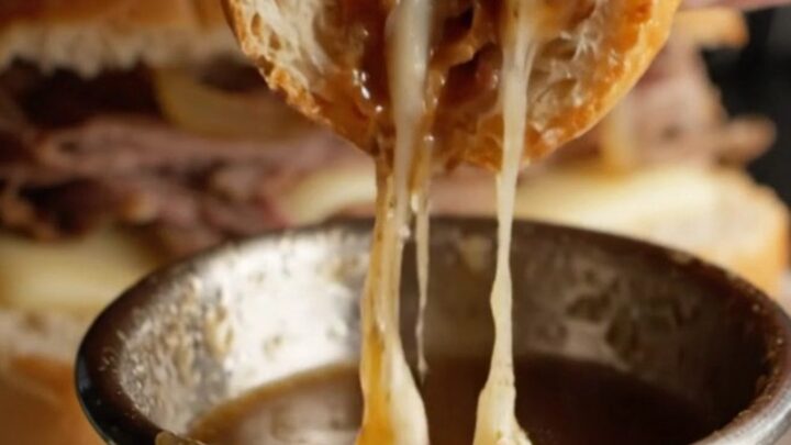French Dip Roast Beef Skillet Sandwich with melted provolone and onion au jus for dipping