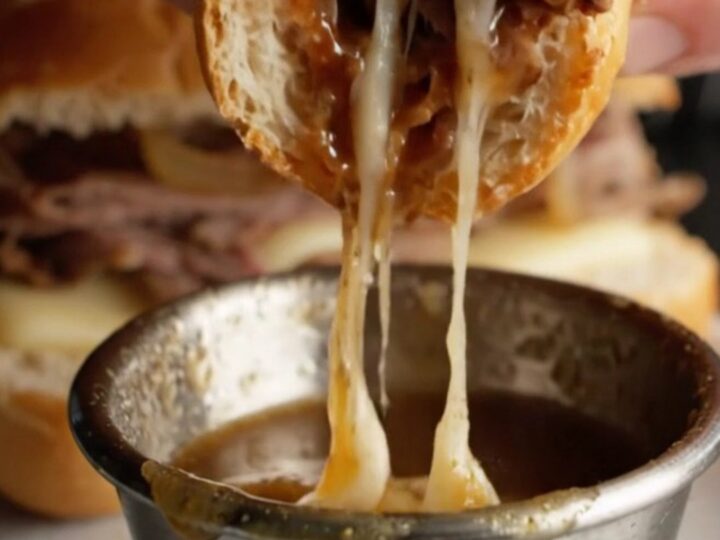 French Dip Roast Beef Skillet Sandwich with melted provolone and onion au jus for dipping