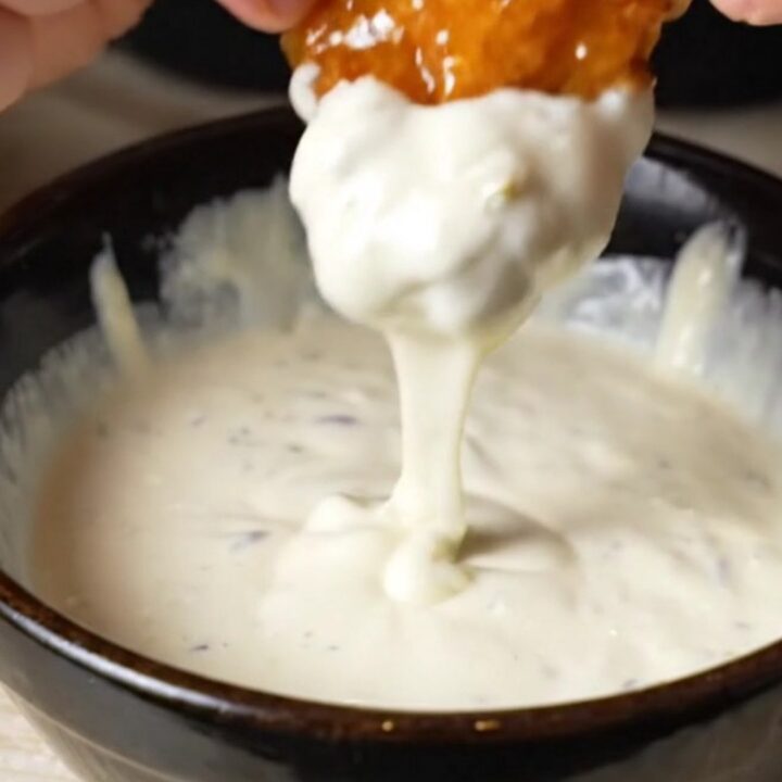 Golden crispy cauliflower wings coated in glossy hot honey buffalo sauce, served with ranch dip