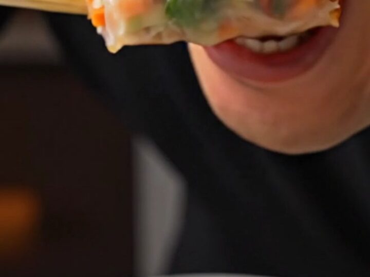 Sliced rice paper spring rolls with shrimp and purple cabbage, served with Nuoc Cham dip