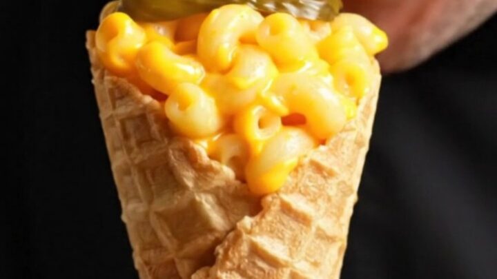 Waffle cone filled with mac and cheese, topped with crispy Nashville hot chicken and pickles