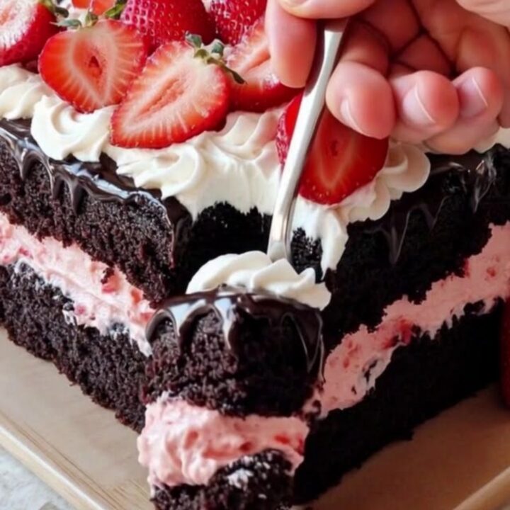 A full multi-layer strawberry Ding Dong sheet cake with chocolate ganache and strawberry rosettes.