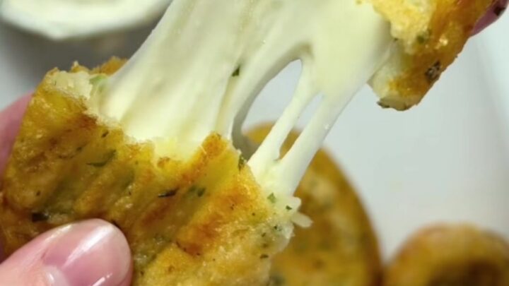 Golden potato croquettes with a mozzarella pull, served with ranch dip