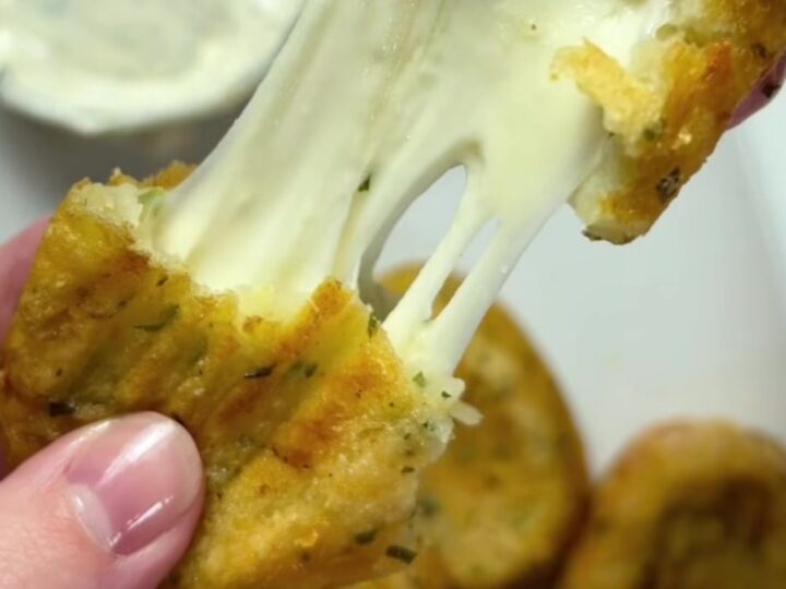 Golden potato croquettes with a mozzarella pull, served with ranch dip