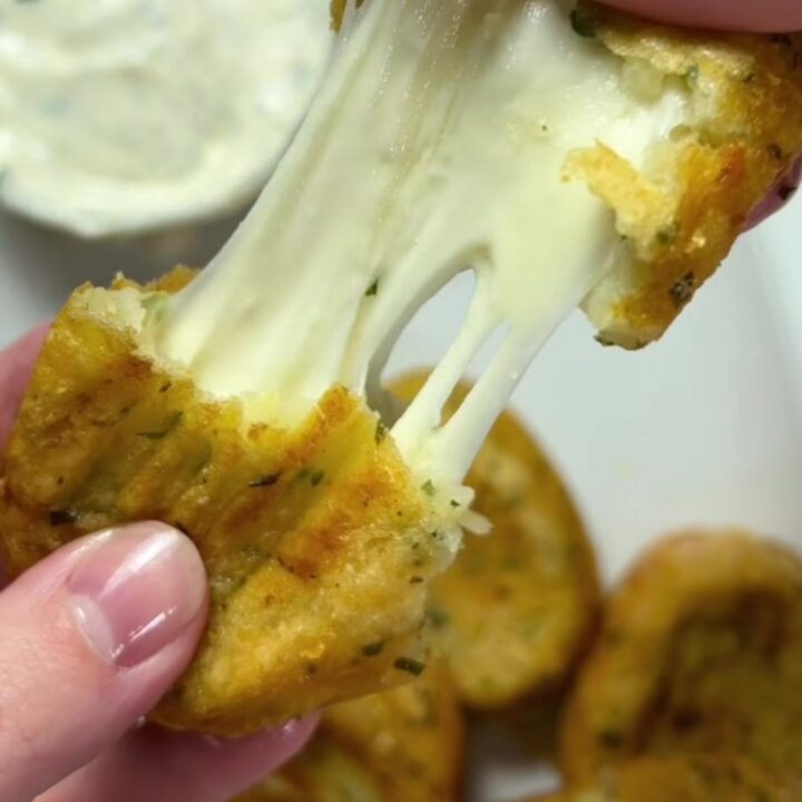 Golden potato croquettes with a mozzarella pull, served with ranch dip