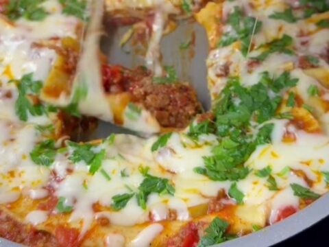 Skillet lasagna roll-ups with melted mozzarella and basil