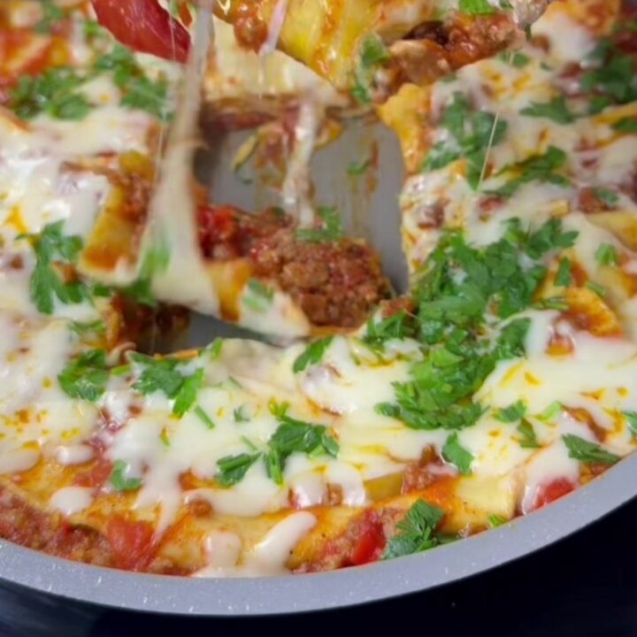 Skillet lasagna roll-ups with melted mozzarella and basil