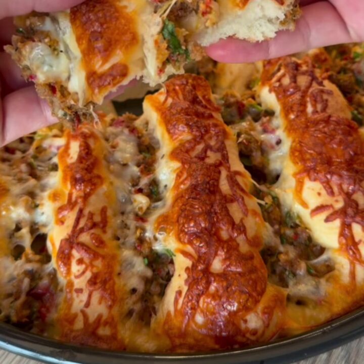 Blistered Turkish lahmacun pide with spiced beef, lemon wedges, and parsley