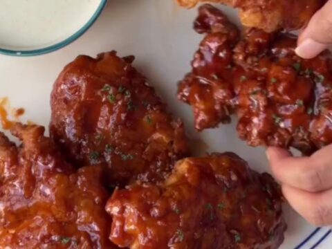 Crispy chicken tenders glazed in sweet chili garlic sauce, topped with sesame seeds