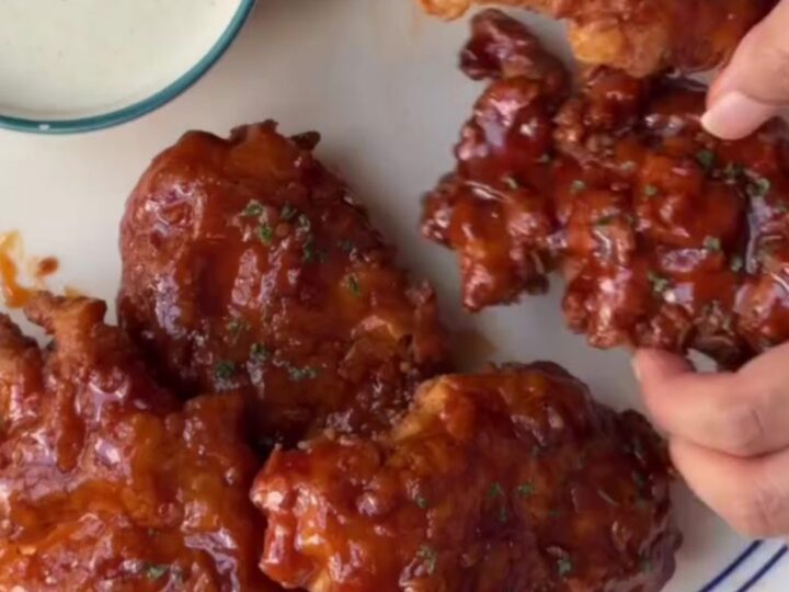 Crispy chicken tenders glazed in sweet chili garlic sauce, topped with sesame seeds