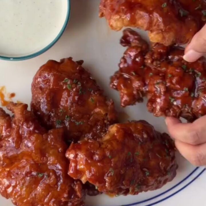 Crispy chicken tenders glazed in sweet chili garlic sauce, topped with sesame seeds