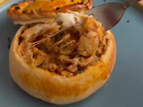 Golden bread pot casserole with bubbly mozzarella and a dough lid