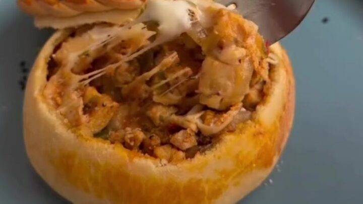 Golden bread pot casserole with bubbly mozzarella and a dough lid