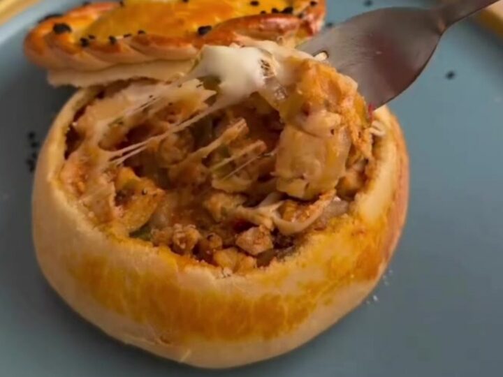 Golden bread pot casserole with bubbly mozzarella and a dough lid