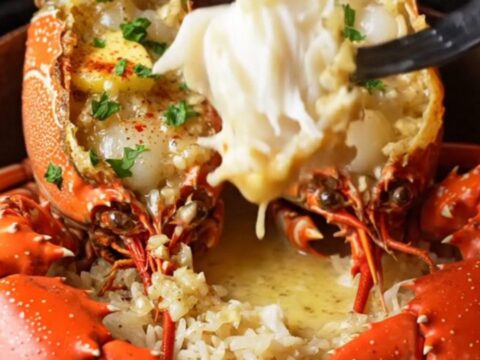 Broiled lobster tails with garlic cream sauce over jasmine rice