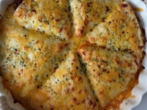 Golden baked beef pockets with melted mozzarella stretching, brushed with garlic butter