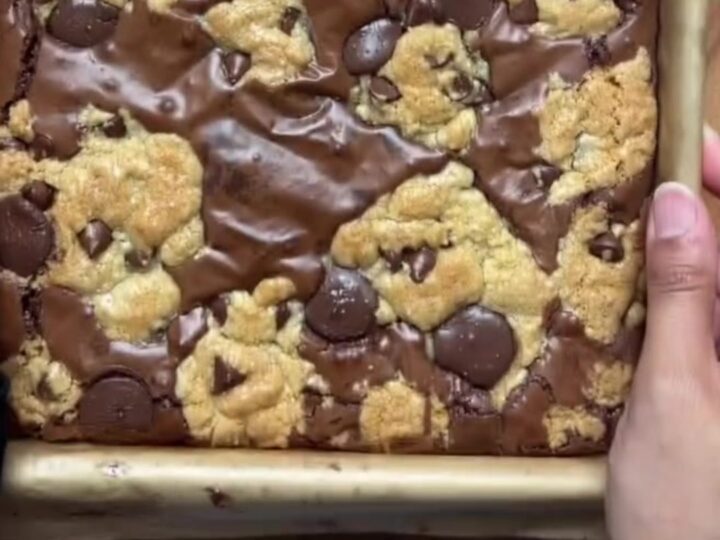 Brookies cut into squares, showing fudgy brownie bottom and chewy cookie top with flaky salt.