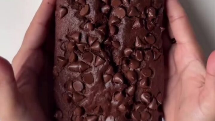 Fudgy double chocolate banana bread loaf with a crackly top and melted chocolate chips