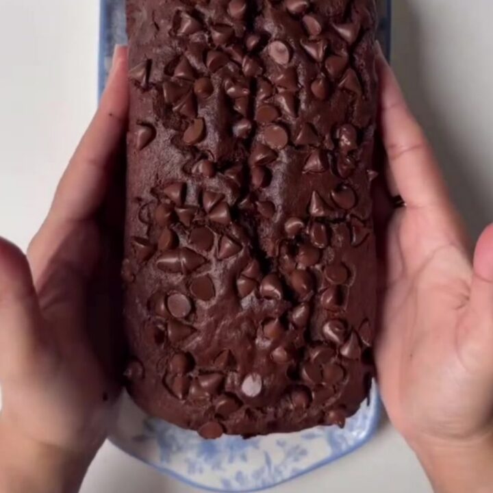 Fudgy double chocolate banana bread loaf with a crackly top and melted chocolate chips