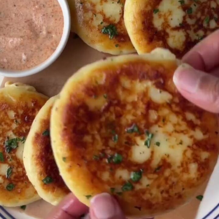 Golden stuffed potato flatbread with molten mozzarella cheese stretching from a slice
