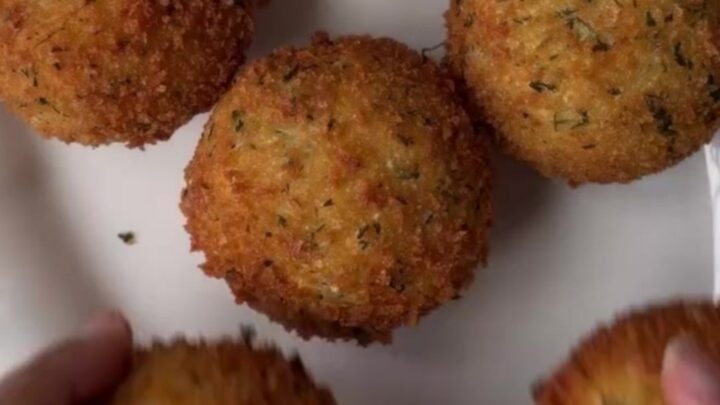 Crispy golden potato cheese balls with a stretchy mozzarella pull, coated in garlic butter and parmesan