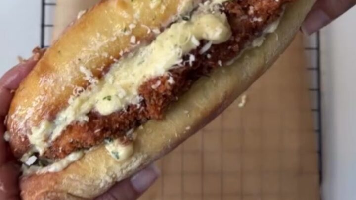 Crispy chicken Alfredo sandwich on toasted garlic ciabatta with melted provolone