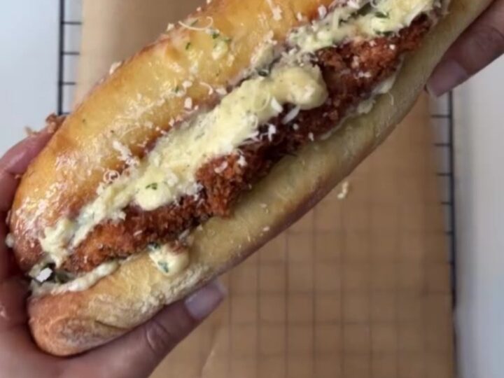Crispy chicken Alfredo sandwich on toasted garlic ciabatta with melted provolone