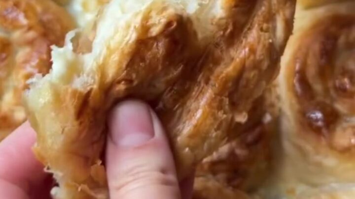 Golden puffed Turkish börek squares with feta and parsley, topped with a crispy, shattering crust.
