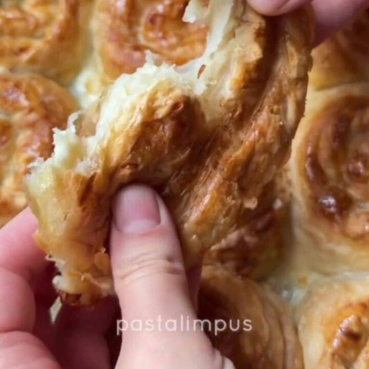 Golden puffed Turkish börek squares with feta and parsley, topped with a crispy, shattering crust.
