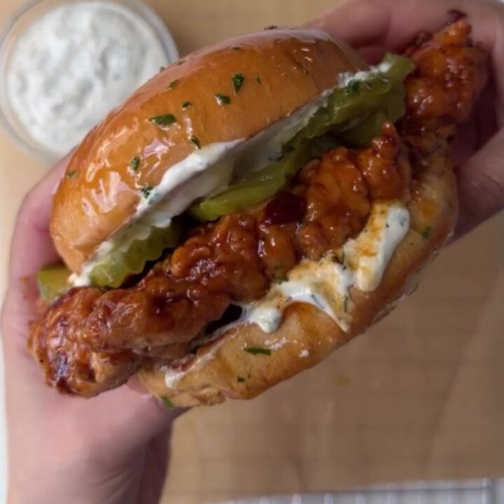 Crispy chicken sandwich with honey chipotle glaze, ranch, and pickles on toasted brioche