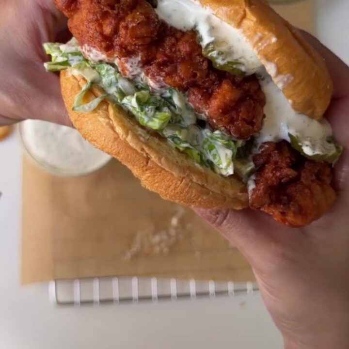 Crispy Nashville hot chicken sandwich on toasted brioche with coleslaw and pickles