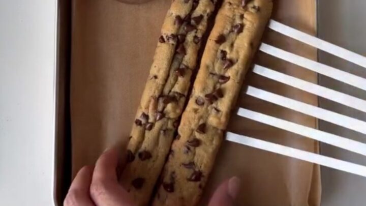 Crispy chocolate chip cookie fries in a red fry carton with warm chocolate fudge dip