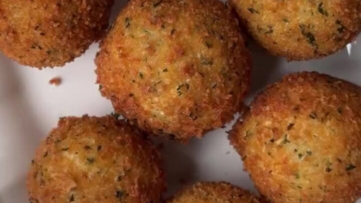 Golden fried potato cheese balls with a cheesy pull, coated in garlic butter and Parmesan.