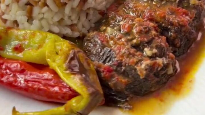 Whole roasted eggplants fanned accordion-style, stuffed with spiced beef and tomato