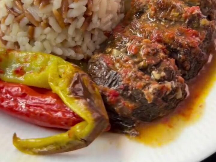 Whole roasted eggplants fanned accordion-style, stuffed with spiced beef and tomato