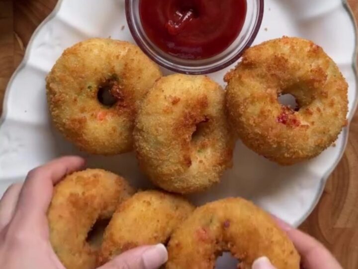 Golden fried potato chicken donuts with a cheese pull and garlic dip