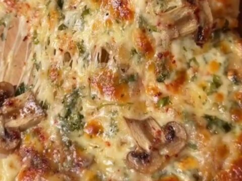 Mini pide boats with golden crust, melted cheese, and mushrooms