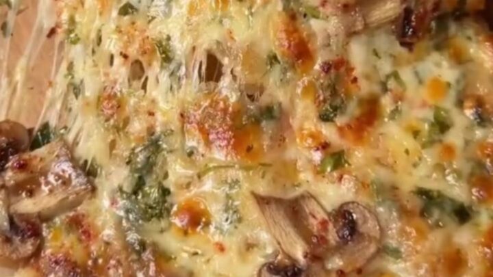 Mini pide boats with golden crust, melted cheese, and mushrooms
