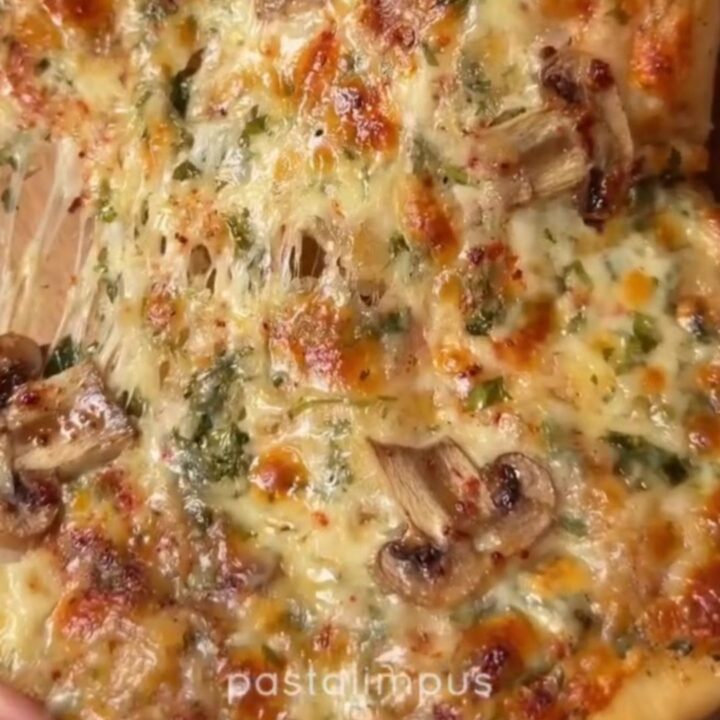 Mini pide boats with golden crust, melted cheese, and mushrooms
