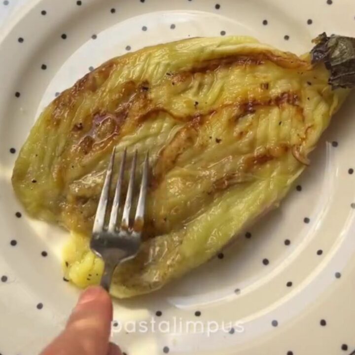 Crispy Turkish fan-fried eggplant with garlic yogurt and red pepper butter on a serving platter
