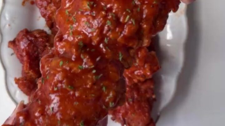 Crispy honey BBQ chicken tenders on a plate with creamy dip