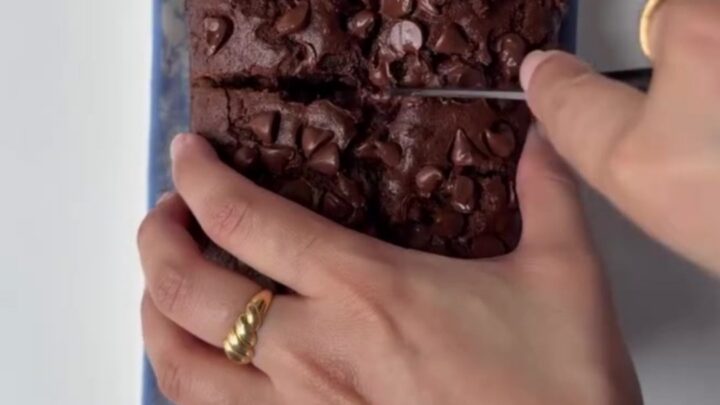 Sliced double chocolate banana bread showing fudgy crumb and melted chocolate chips