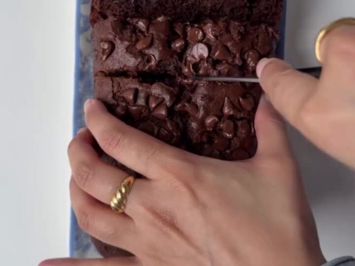 Sliced double chocolate banana bread showing fudgy crumb and melted chocolate chips