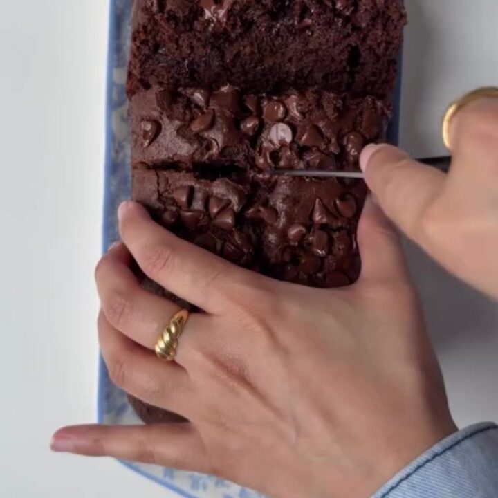 Sliced double chocolate banana bread showing fudgy crumb and melted chocolate chips