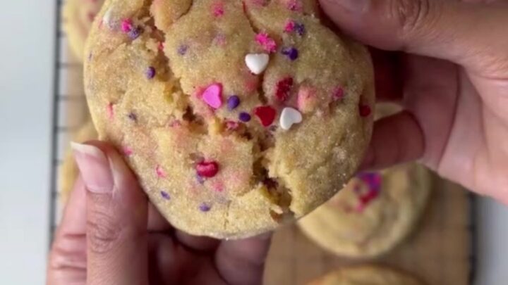 Thick sugar cookies with pink and red sprinkles, showing a soft, buttery center