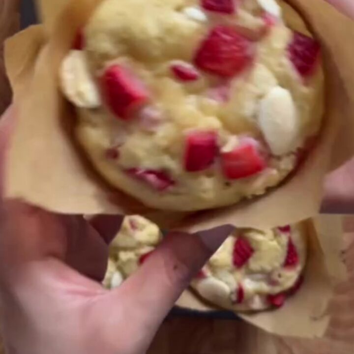 Giant golden muffin with molten white chocolate and strawberries